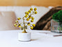 Grape Light Golden Crystal Tree styled on a tabletop beside books and green moss decor