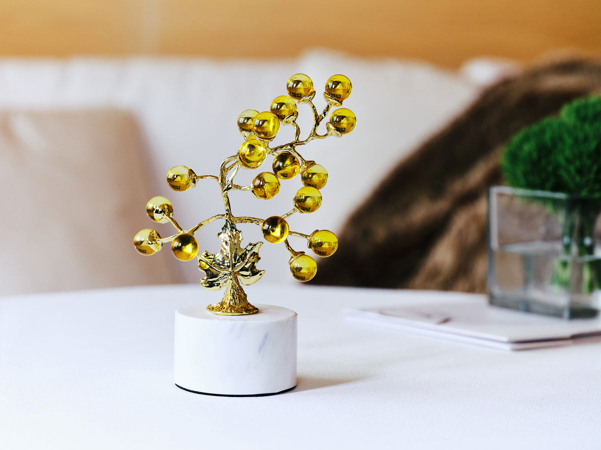 Grape Light Golden Crystal Tree styled on a tabletop beside books and green moss decor