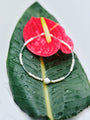 Long Light Necklace from an alternate angle highlighting the pearl spacing and focal detail