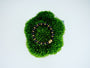 Midnight Orbit Bracelet with deep dark crystal beads and 24K gold-plated copper accents on green moss.